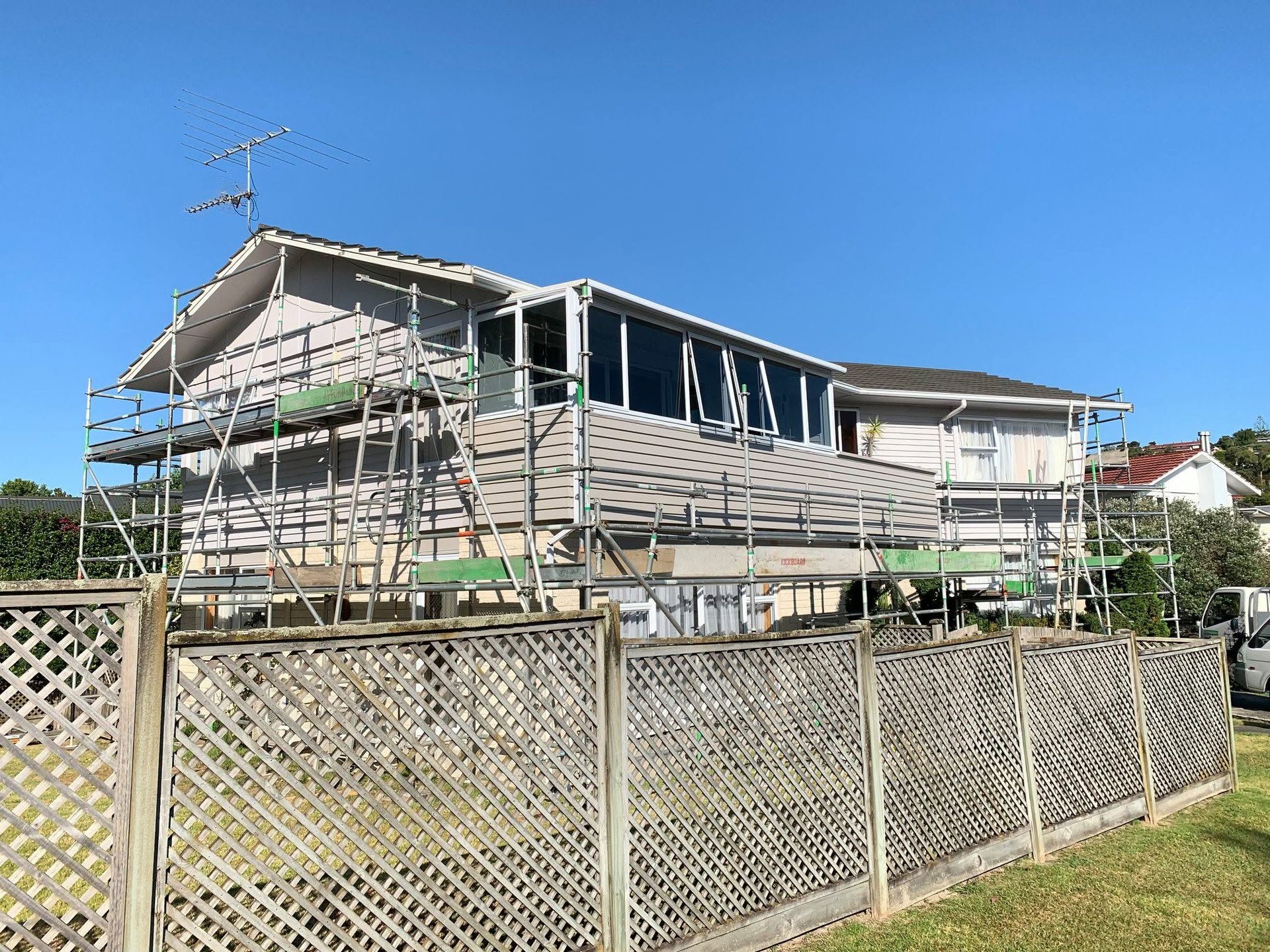 Villa exterior mid-project with scaffolding